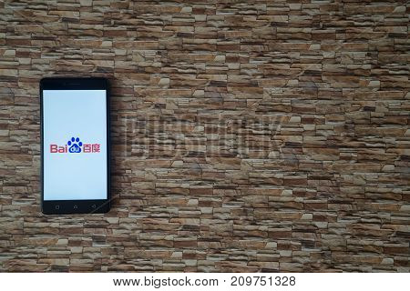 Los Angeles, USA, october 19, 2017: Baidu logo on smartphone screen on stone facing background