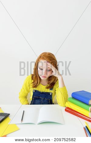 Smart girl is sudying and doing her homework