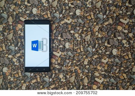 Los Angeles, USA, october 18, 2017: Microsoft office word logo on smartphone on background of small stones