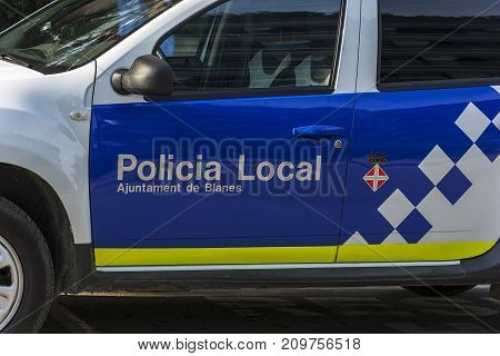 Spain, Blanes - 23.09.2017: On the door of a police car Policia Local (Blanes Catalonia Spain)