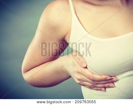 Woman Holding Hands On Her Breast