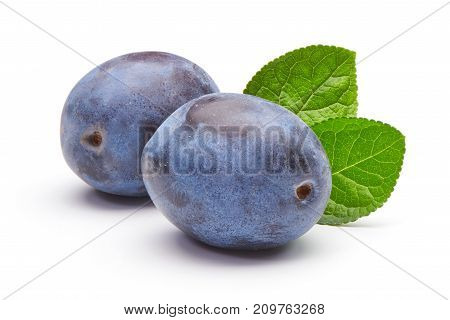 Plums With Leaves Isolated On White Background