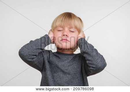 Cute horisontal photo of handsome happy caucasian child