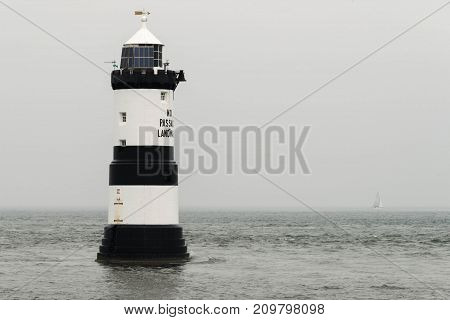 Penmon Lighthouse (anglesey Wales) On A Cloudy Day