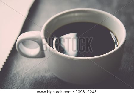 Coffee Cup And Saucer On A Wooden Table .