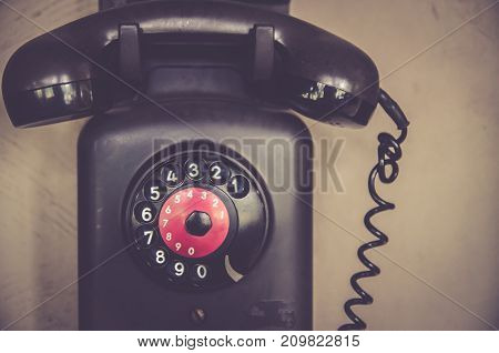 Dialer and wood details of an old phone (antique telephone)
