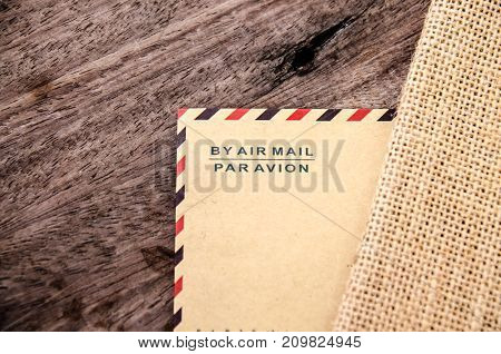 very old paper or letter envolop on wood
