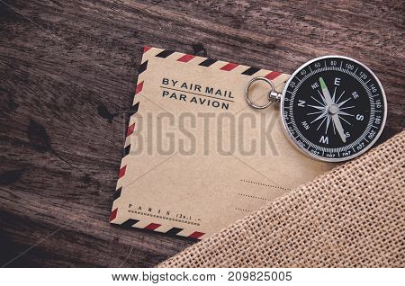 Vintage compass on the very old paper or letter envolop
