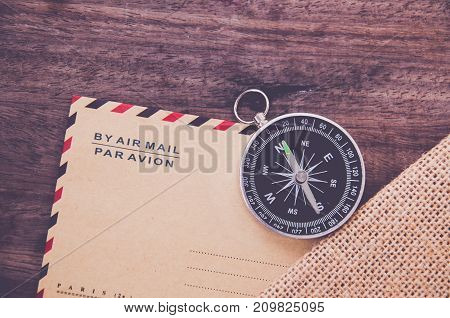 Vintage compass on the very old paper or letter envolop