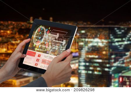 Cropped 3D image of businesswoman holding digital tablet against high angle view of illuminated crowded cityscape