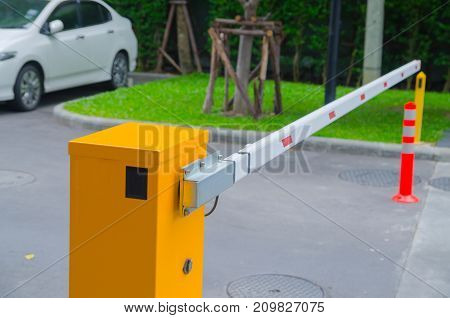 Security system for building access - barrier gate stop with toll booth traffic cones and cctv
