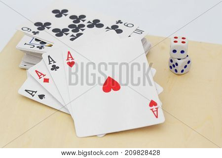 Four aces in the foreground. Concept of gambling.