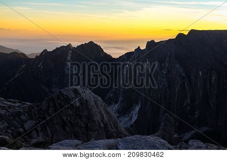 View from the top of Low's Peak of Mountain Kinabalu,Sabah during morning sunrise.Its the highest mountain in Malaysia is one of Borneo's most popular tourist attractions & climbers.