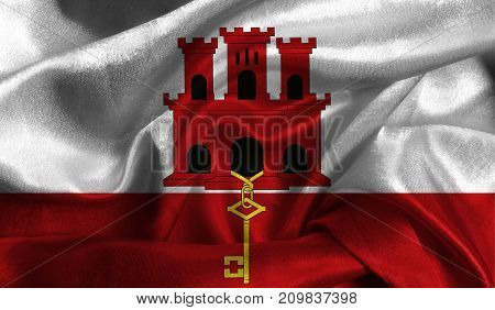 Realistic flag of Gibraltar on the wavy surface of fabric. This flag can be used in design.