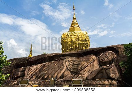 Golden pagoda sculpturestone carving at Wat Tham Pha Daen.Sakon NakhonThailand( Generality in Thailandand kind of art decorated in Buddhist churchtemple paviliontemple hall.They are public)