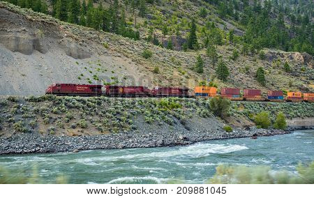 EPSOM PROVINCIAL PARK, CANADA - JULY 2, 2017: Freight train of Canadian Pacific Railway moving along the Thompson River.