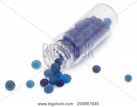 Silica gel used as absorbent of moisture over white background