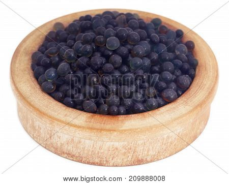 Silica gel in a wooden bowl over white background