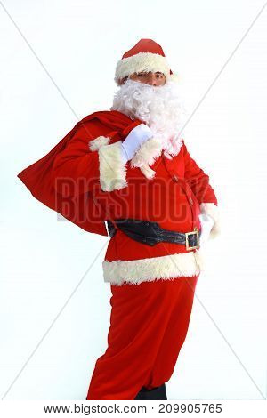 Santa Claus running with the bag of the presents.
