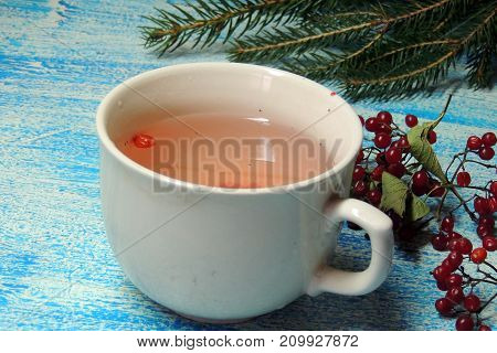Hot tea viburnum. Tea viburnum in a glass cup.