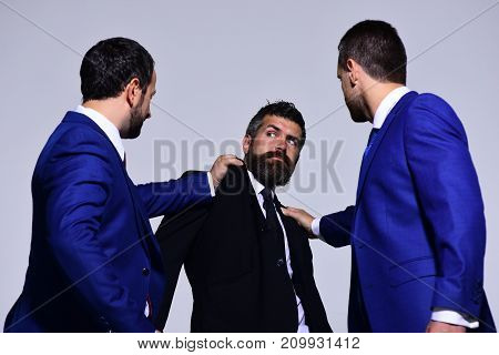 Businessmen With Strict And Scared Faces In Formal Suits