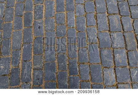 Stone pavement texture. Granite cobblestoned pavement background