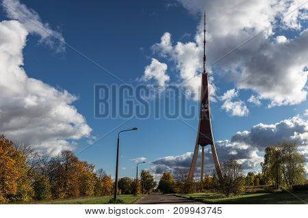 TV tower during autumn time, high telecommunication tower in Riga, Latvia