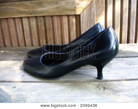 Black Shoes On A Deck