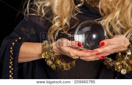 Crystal ball and fortune teller hands. Divination. Seance.