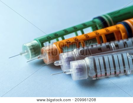 Insulin injection needle or pen for use by diabetics isolated on white background