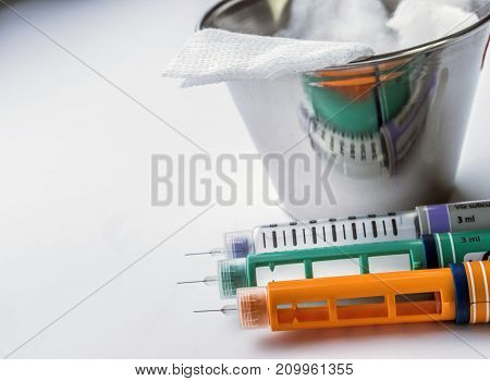 Insulin injection needle or pen for use by diabetics isolated on white background