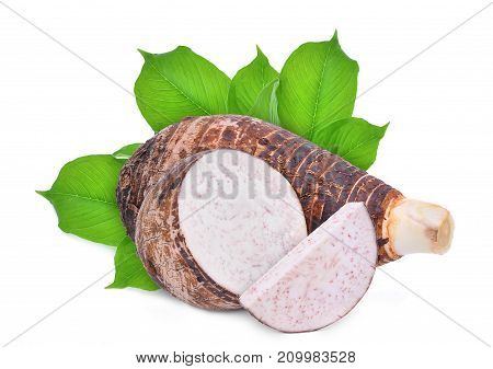whole and slice with green leaves of taro root isolated on white background