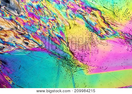 colorful microscopic shot of Trisodium citrate microcrystals in polarized light