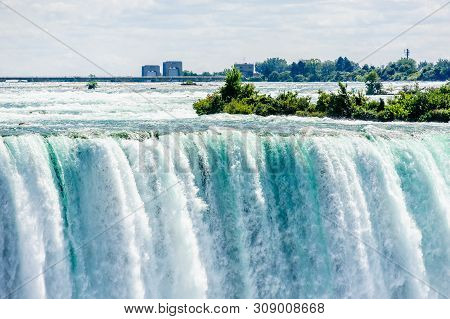 Dangerous Rapids Falling Over Edge At Top Of Horeshoe Falls At Niagara Falls, Ontario, Canada.