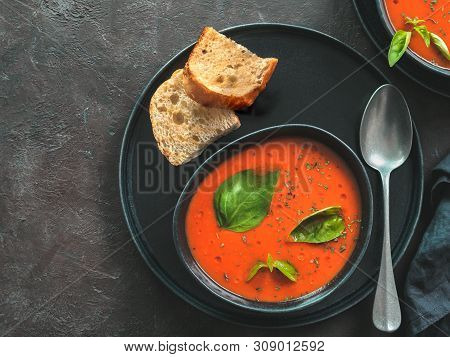 Gaspacho Soup In Black Bowl. Traditional Spanish Cold Soup Puree Gaspacho Or Gazpacho On Dark Backgr