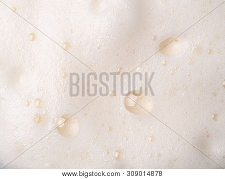 Foam Texture Extreme Close Up As Background. Beer Or Cappucino Foam With Bubbles Macro Shoot. Copy S