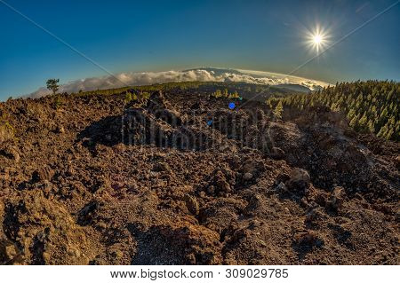 Magical Sunset Time Above The Clouds In The Tenerife Mountains In Canary Islands. Fresh Lava Fields
