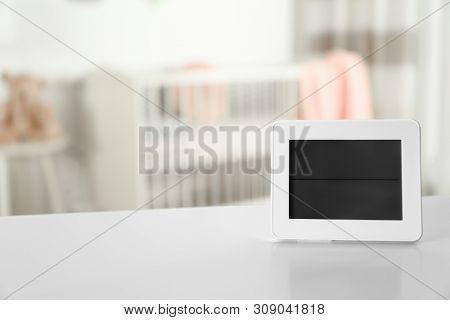 Digital Temperature And Humidity Control In Baby Room Interior. Space For Text