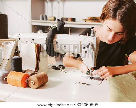 Bespoke Service. Tailor Workplace. Seamstress Sewing Clothes And Threading Needle.