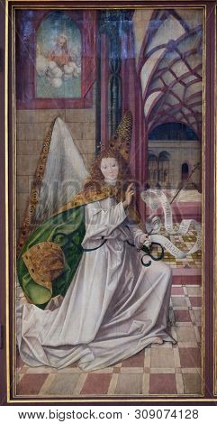 WURZBURG, GERMANY - JULY O4, 2018: Archangel Gabriel, The Annunciation, main altar in Marienkapelle in Wurzburg, Bavaria, Germany