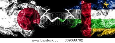 Japan Vs Central African Republic Smoky Mystic Flags Placed Side By Side. Thick Colored Silky Smokes
