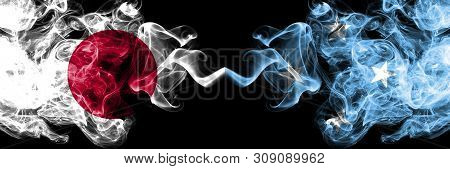 Japan Vs Micronesia, Micronesian Smoky Mystic Flags Placed Side By Side. Thick Colored Silky Smokes 