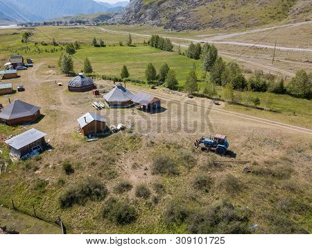 Aerial View Of A Settlement In The Altai Mountains With Small Houses For Indigenous People And Touri
