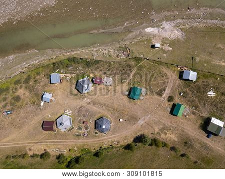 Aerial View Of A Settlement In The Altai Mountains With Small Houses For Indigenous People And Touri