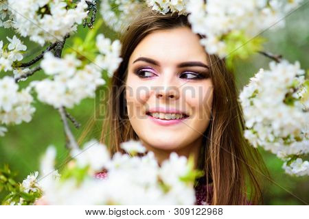 Skincare. Summer Blooming Trees And Flowers. Sexy Woman In Spring Blossom. Natural Beauty Makeup. Ha
