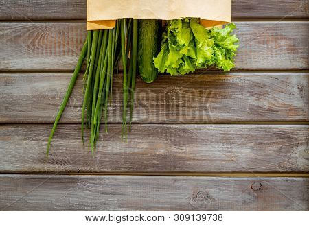 Buying Fresh Vegetables In Paper Bag On Wooden Background Top View Copyspace