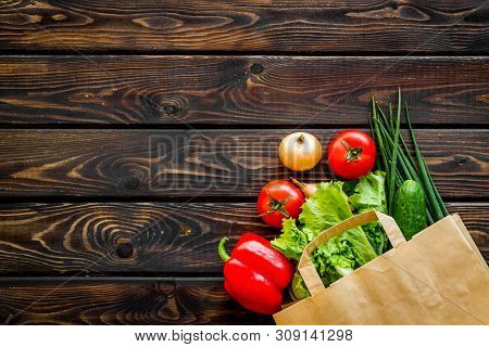 Buying Fresh Vegetables In Paper Bag On Wooden Background Top View Copyspace