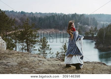 Young Beautiful Girl Posing On A Background Of Lake