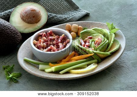 Keto Diet, Close-up On Avocado Rose Salad With Bacon Cubes And Smoked Cheese Seasoned With Lemon, Mi