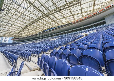 Porto, Portugal - April 2018: Blue Chairs In The Tribunes Of Estadio Do Dragao Stadium